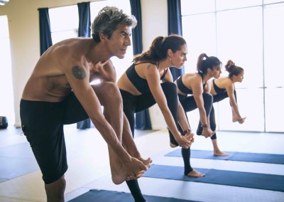 People doing yoga as part of a yoga studio marketing shoot